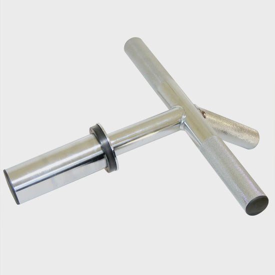 A chrome forearm and wrist bar clamped on a rack, shown in use