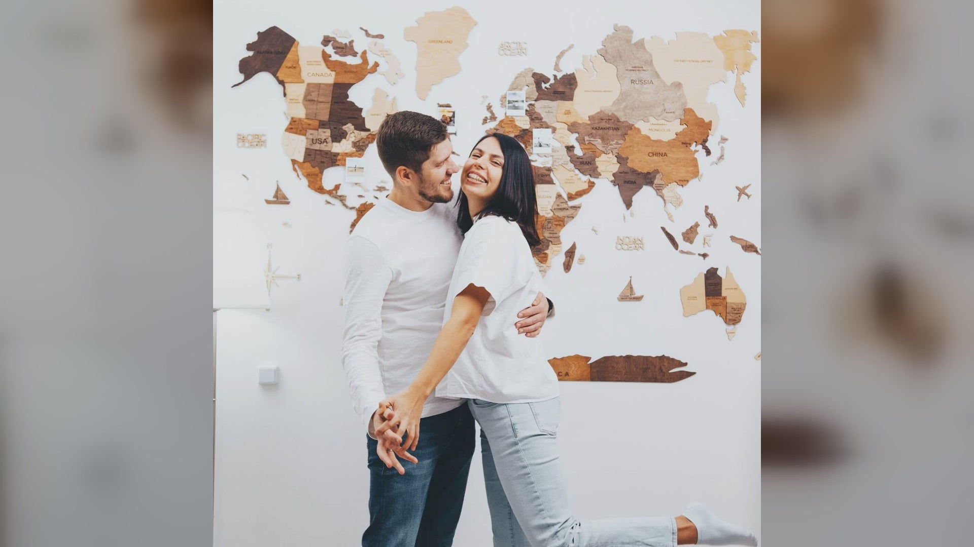 Multicolor 3D wooden world map shown on living room walls