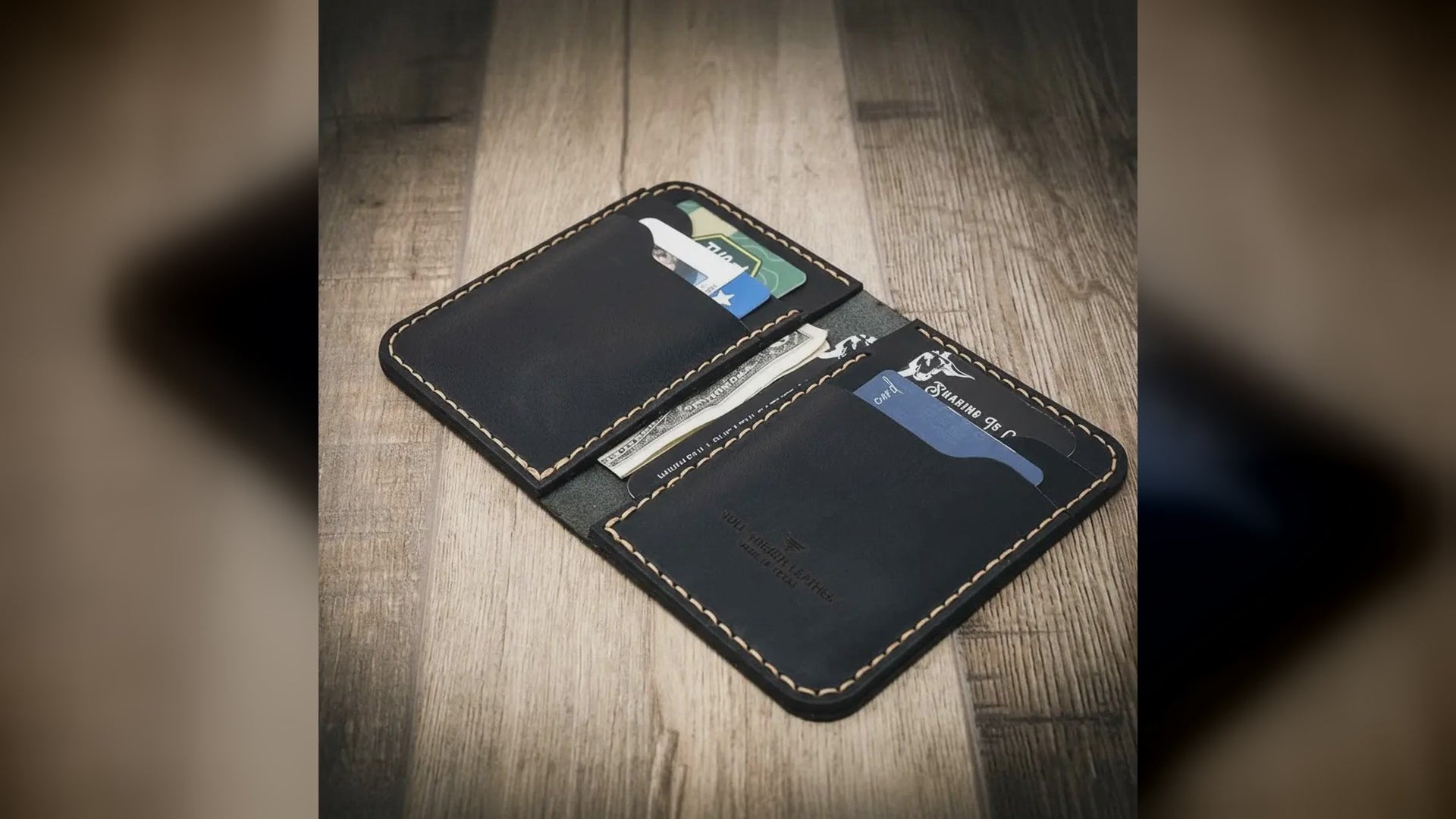 Bull Sheath Tyler vertical leather wallet in black