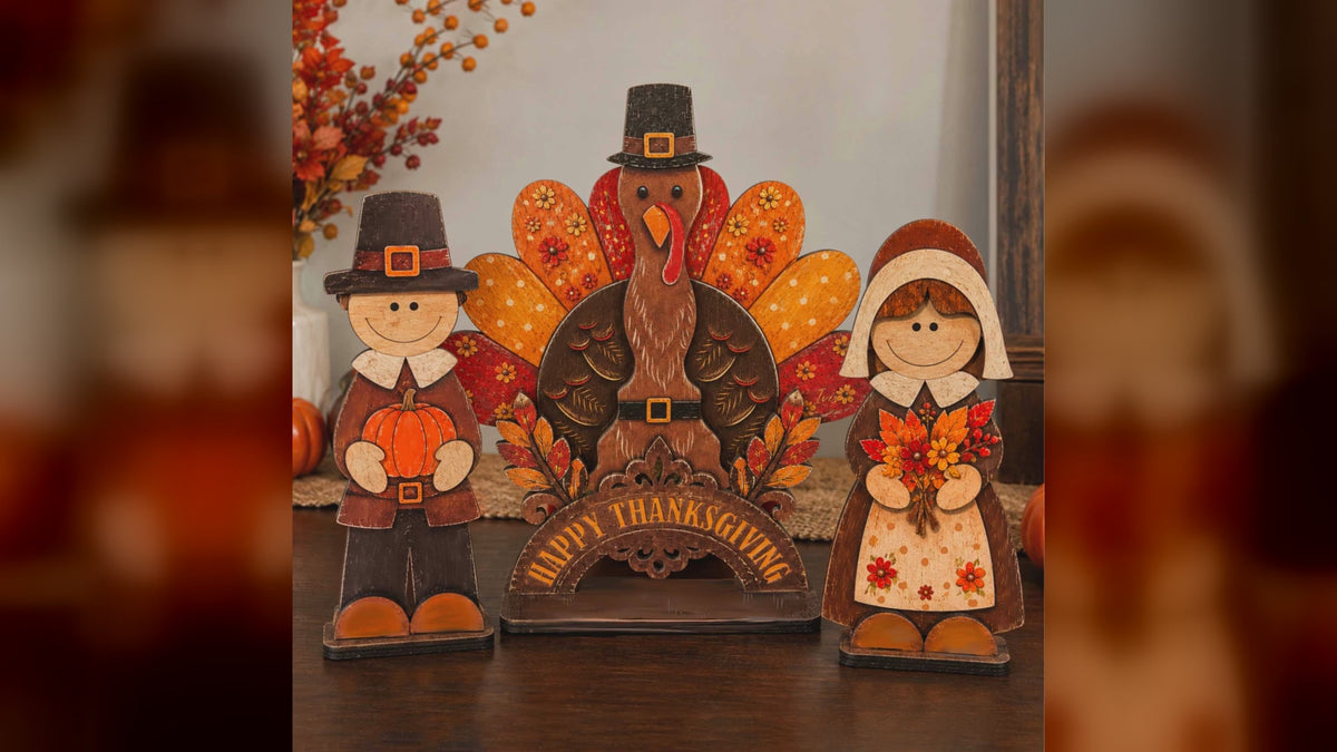 Three wooden Thanksgiving pilgrim and turkey tabletop decorations