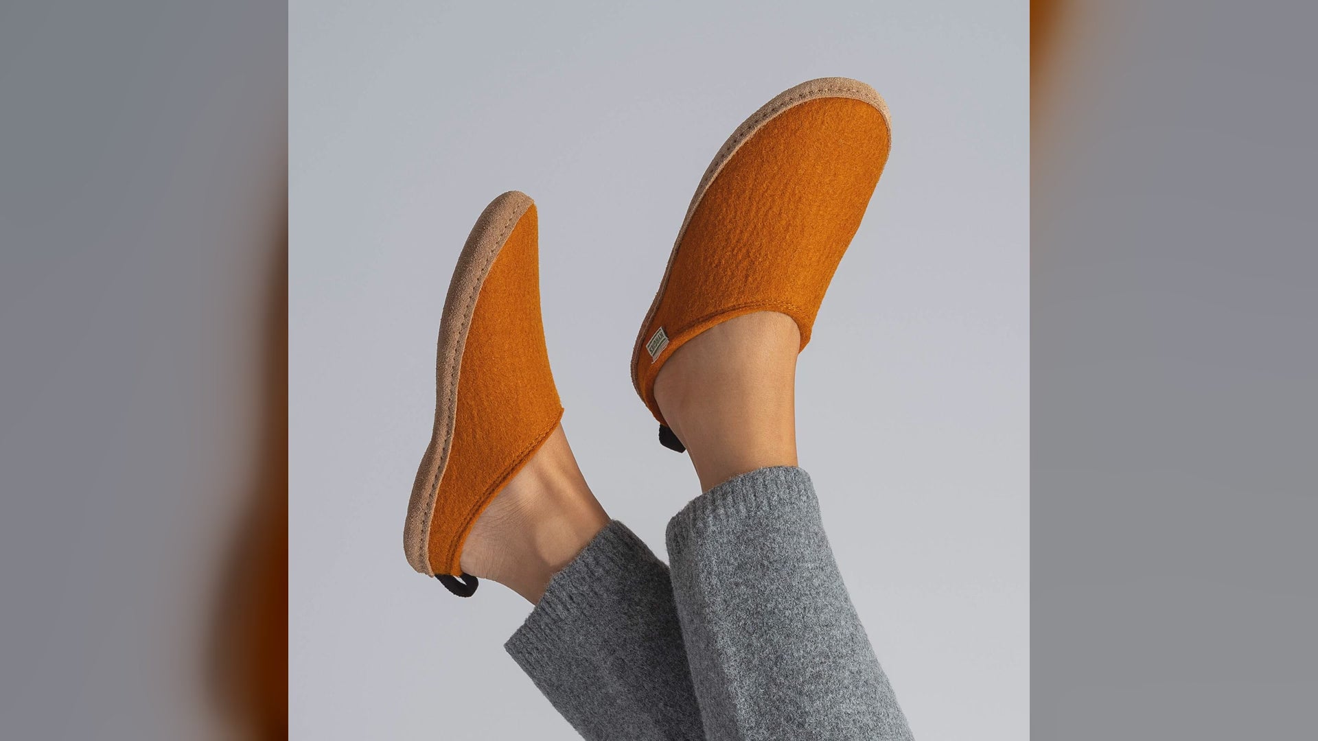 Kyrgies wool slides worn indoors and close-ups in Orange, Magenta, Pine Green and Oatmeal