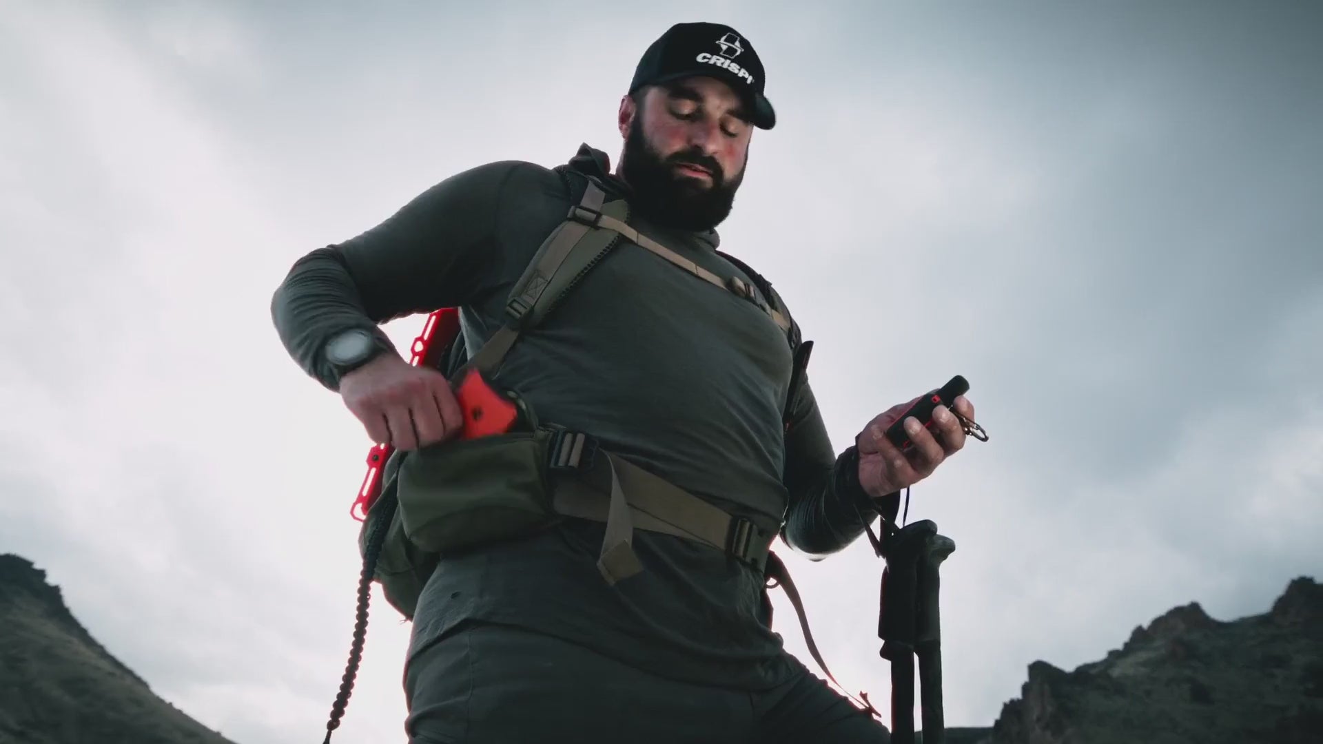 A Dark Energy Poseidon Pro power bank charging a phone outdoors