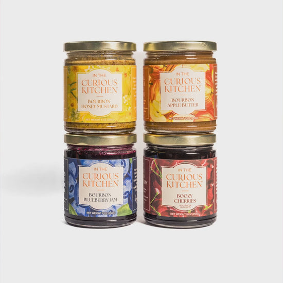Four jars from the Bourbon Gift Set with serving shots