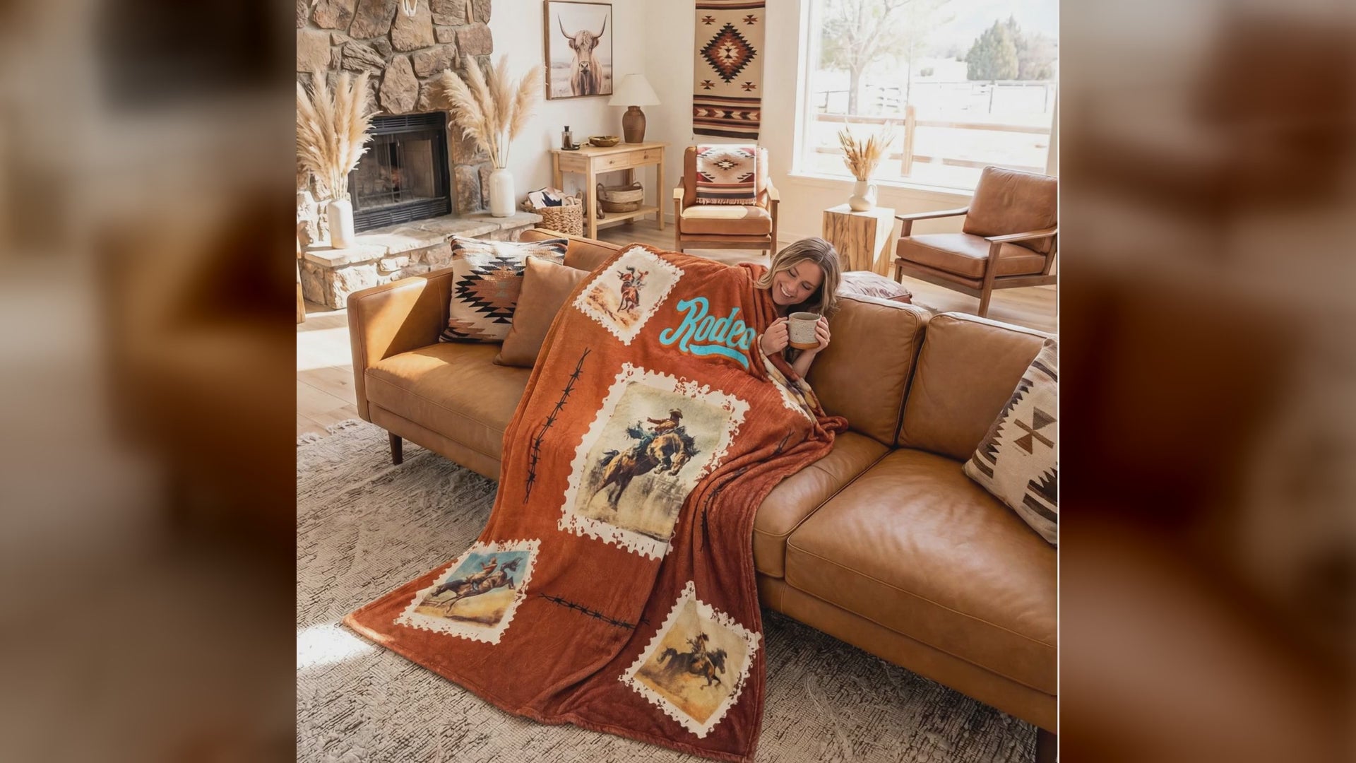 A western Rodeo throw blanket draped over a sofa and armchair